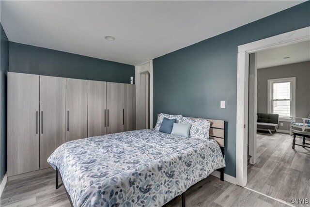 bedroom with light wood-type flooring