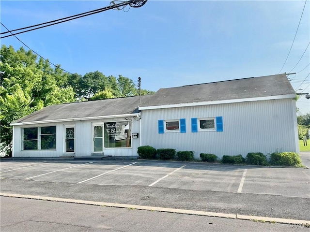554 S 1st St, Fulton, NY 13069 - view of building exterior with uncovered parking