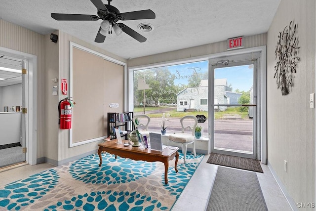554 S 1st St, Fulton, NY 13069 - sitting room with a textured ceiling, tile patterned flooring, and ceiling fan