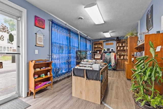 554 S 1st St, Fulton, NY 13069 - home office featuring a textured ceiling and wood finished floors