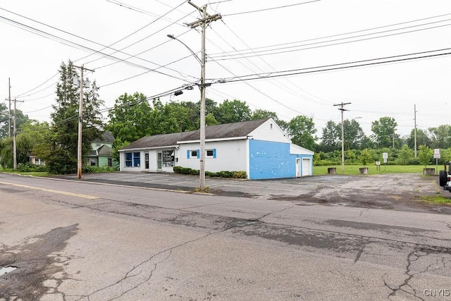 554 S 1st St, Fulton, NY 13069 - view of building exterior with a garage
