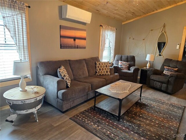 living room featuring hardwood / wood-style flooring, an AC wall unit, wooden ceiling, and a wealth of natural light