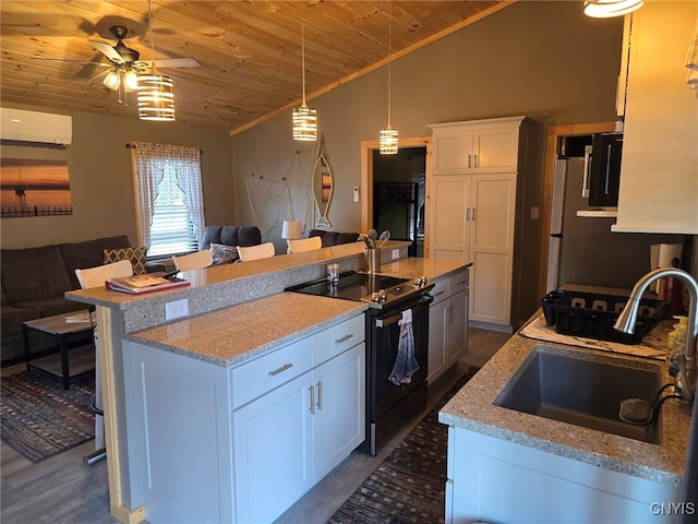 kitchen featuring sink, wooden ceiling, black range with electric cooktop, ceiling fan, and white cabinetry