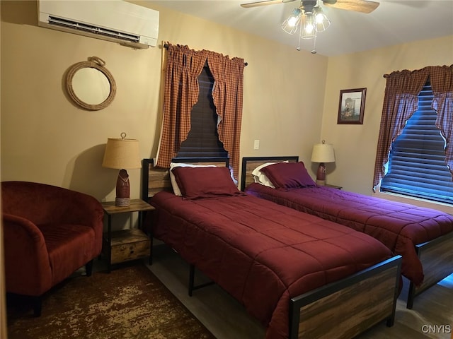 bedroom featuring ceiling fan and a wall mounted AC