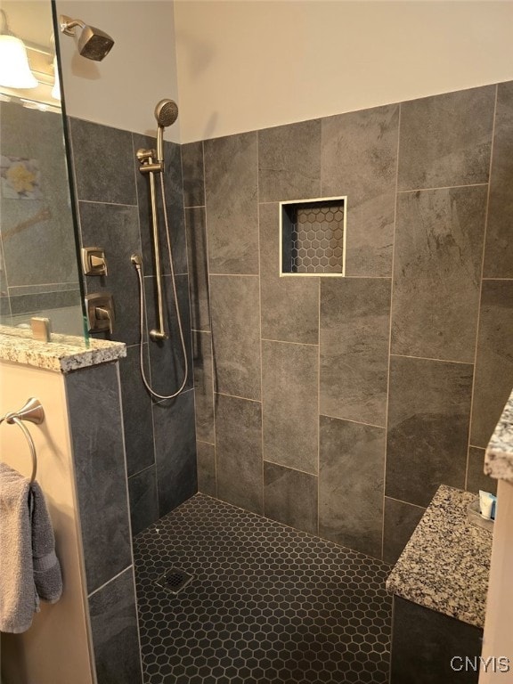 bathroom with tiled shower