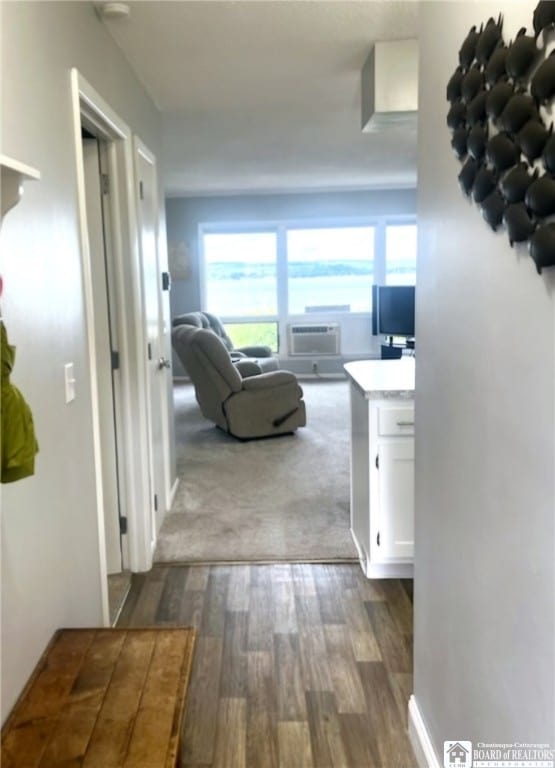 corridor with cooling unit and dark hardwood / wood-style floors