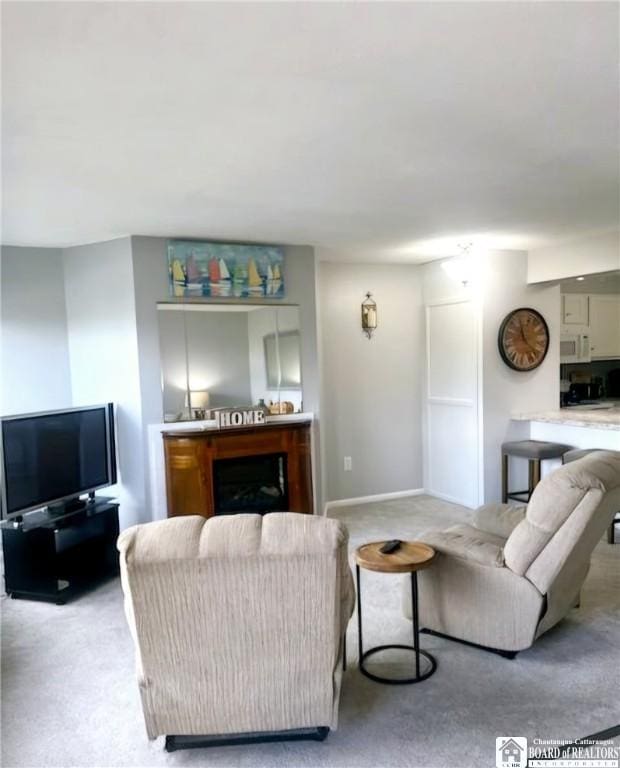 28 Mohawk Dr, Chautauqua, NY 14728 - living room featuring light carpet and a fireplace