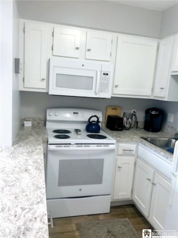 28 Mohawk Dr, Chautauqua, NY 14728 - kitchen featuring white appliances, white cabinetry, and dark wood-style floors