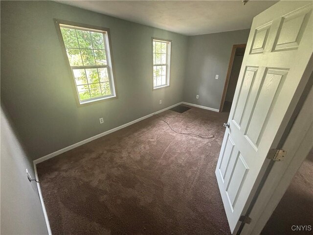 unfurnished bedroom featuring carpet floors