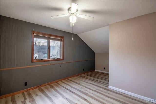 additional living space featuring ceiling fan, light hardwood / wood-style floors, and lofted ceiling