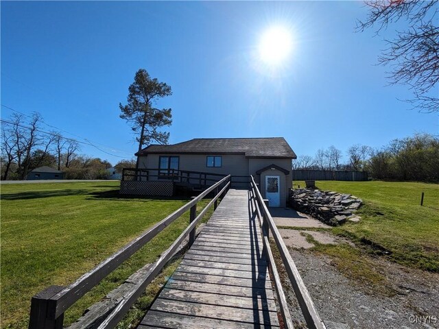 back of house with a lawn