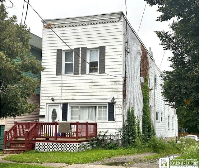 back of house featuring a deck