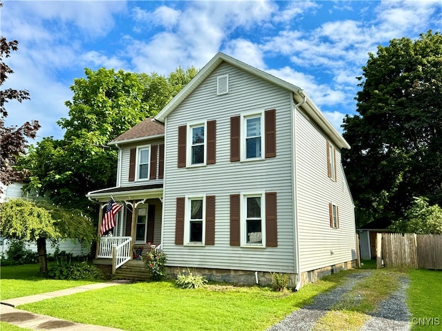 view of front of house featuring a front lawn and a porch