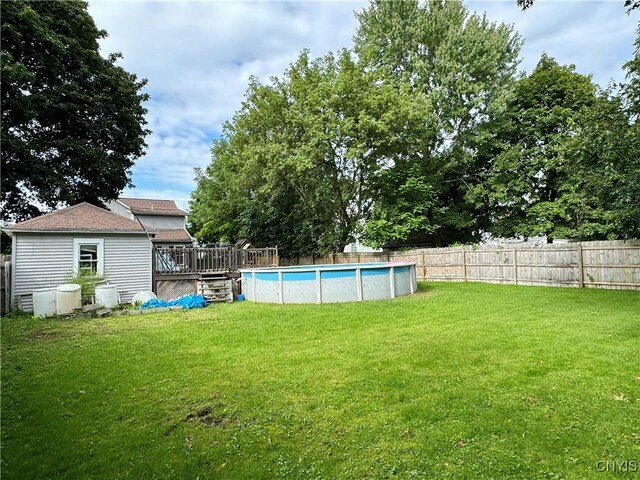 view of yard featuring a pool side deck