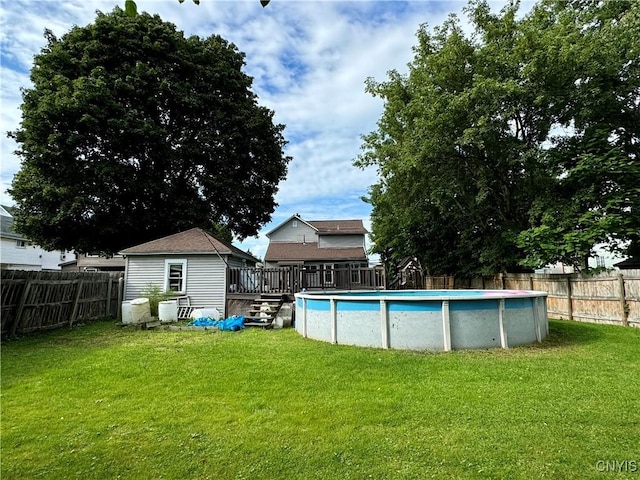 view of pool with a fenced backyard, a fenced in pool, and a lawn