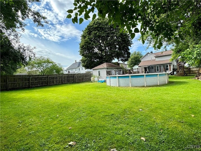 view of yard featuring a fenced backyard and a fenced in pool