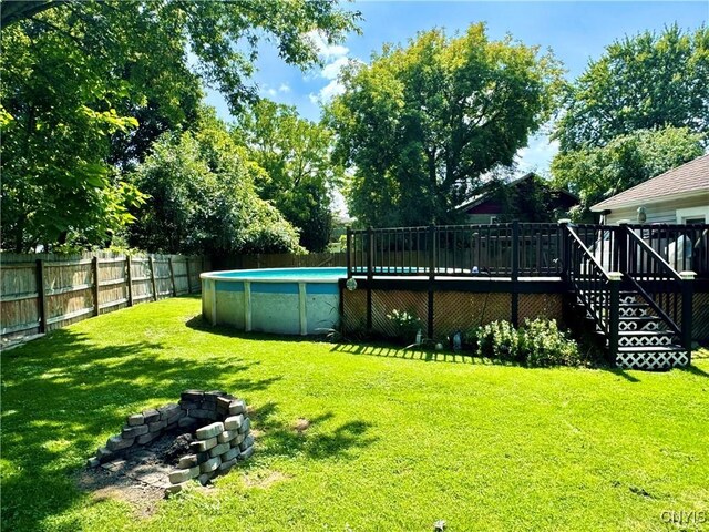 view of yard featuring a swimming pool side deck