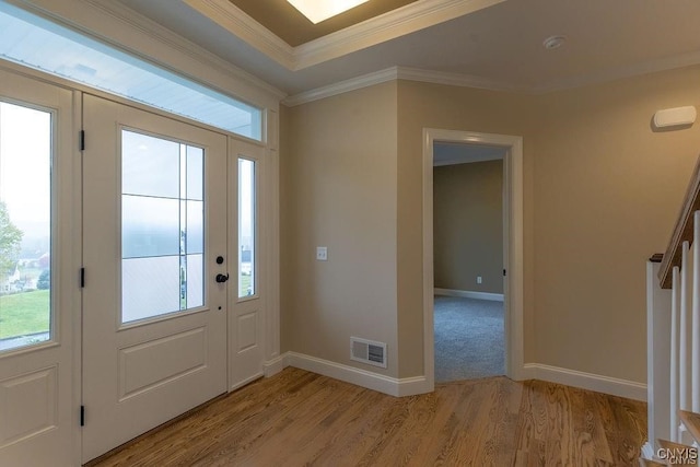 entryway featuring light hardwood / wood-style flooring and ornamental molding