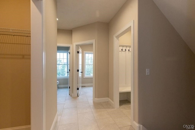 corridor featuring light tile patterned flooring