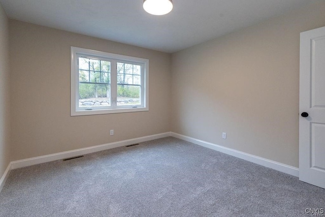 empty room featuring carpet floors