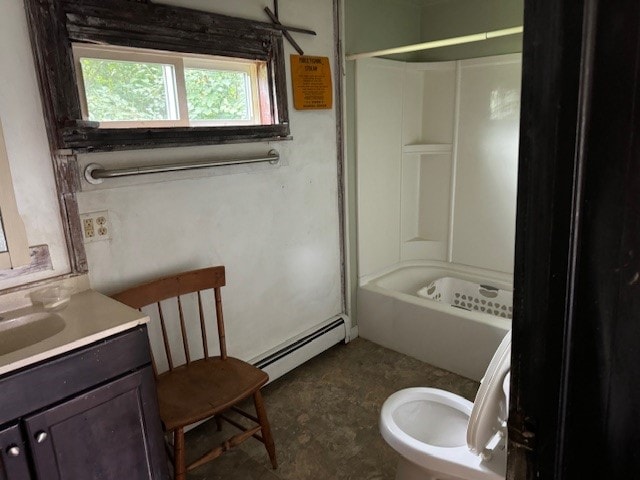 full bathroom with toilet, tub / shower combination, a baseboard heating unit, and vanity