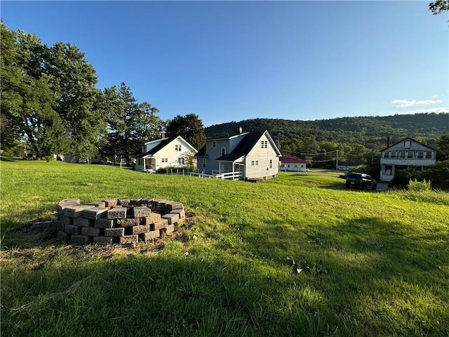 view of yard with an outdoor fire pit