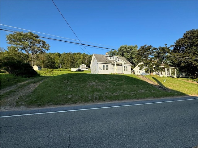 exterior space with a front lawn