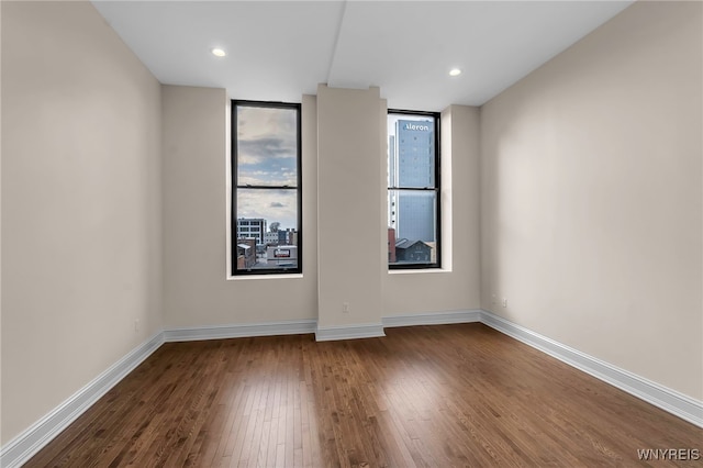 empty room with wood-type flooring