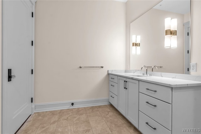 bathroom with tile patterned flooring and vanity