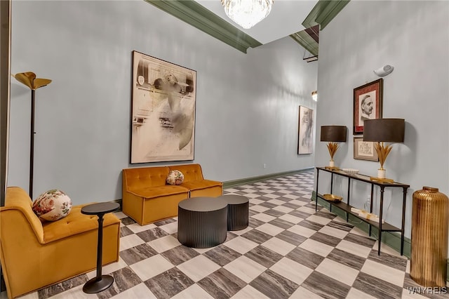 sitting room featuring a high ceiling, tile patterned flooring, and a chandelier