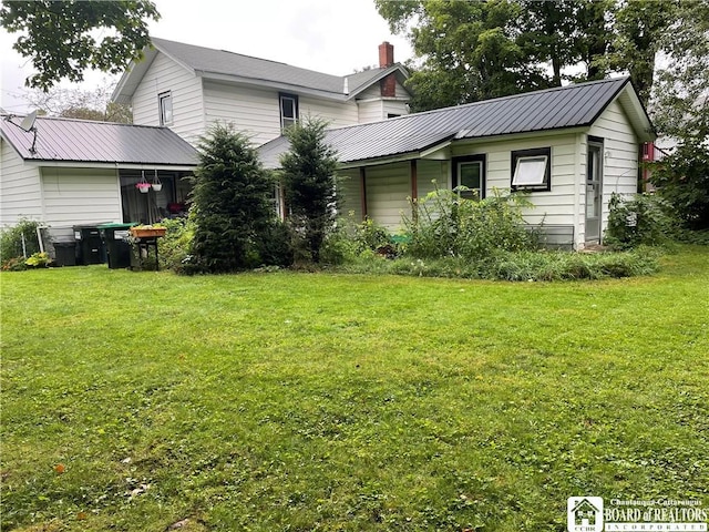14 E Maple St N, Ellery, NY 14712 - rear view of property featuring a yard, metal roof, and a chimney