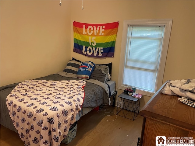 bedroom featuring wood-type flooring