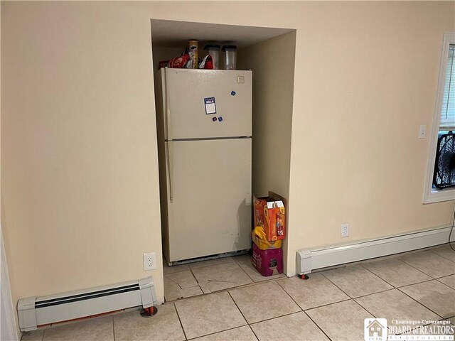 14 E Maple St N, Ellery, NY 14712 - kitchen featuring tile patterned flooring, a baseboard radiator, and freestanding refrigerator