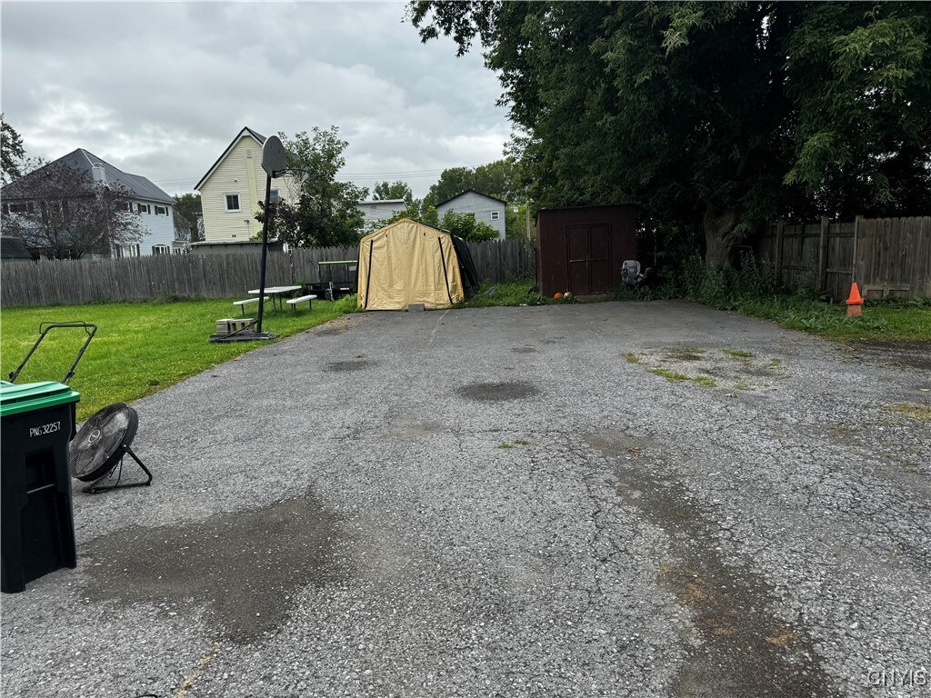 view of patio / terrace featuring a storage unit