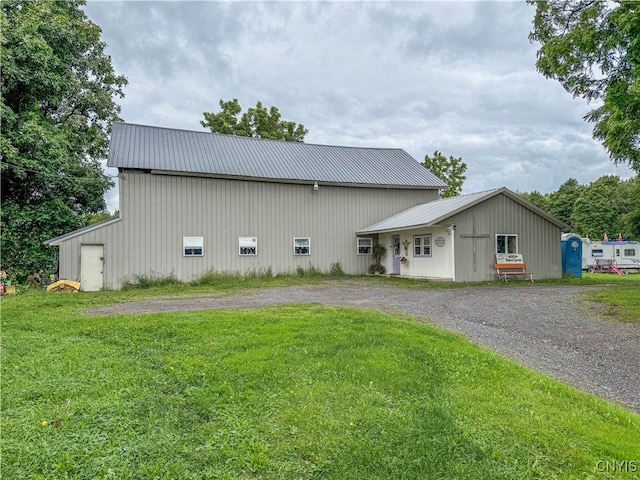 view of home's exterior with a yard