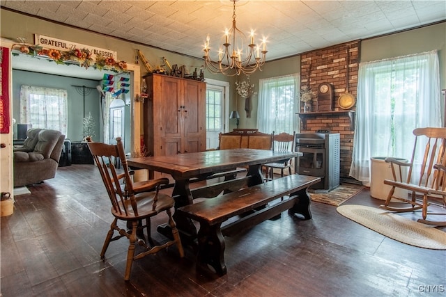 dining space with a notable chandelier, dark hardwood / wood-style flooring, and plenty of natural light