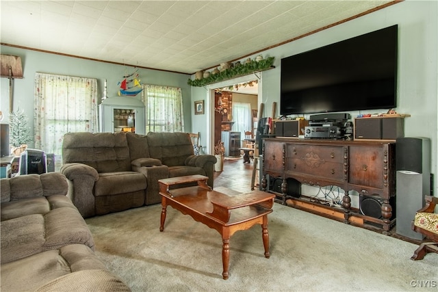 carpeted living room with ornamental molding