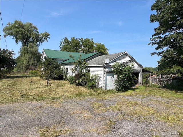 view of property exterior featuring a garage