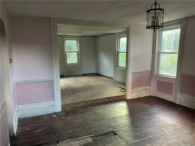 unfurnished room featuring wood-type flooring