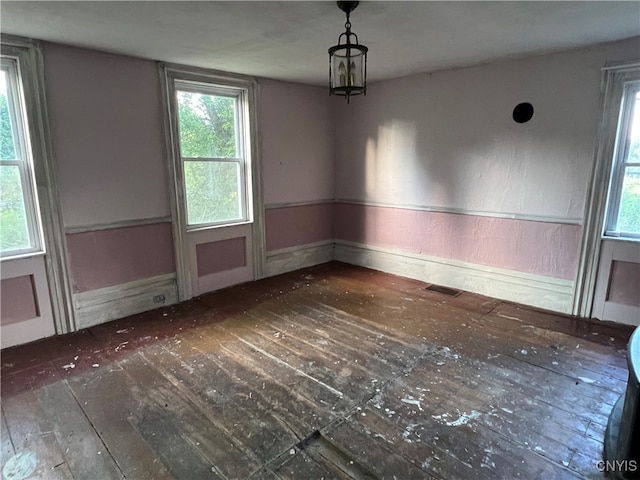 empty room featuring wood-type flooring