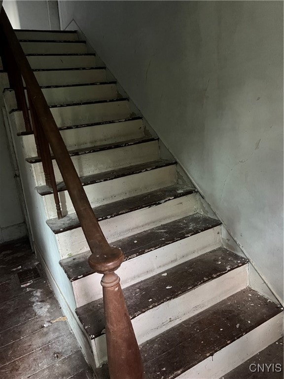 stairway with hardwood / wood-style flooring