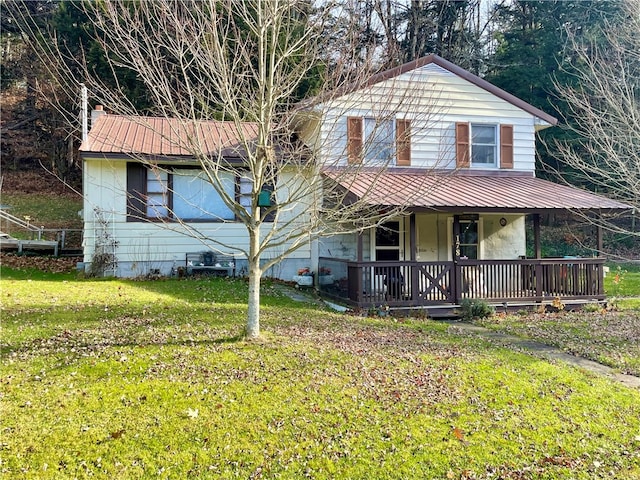 view of front facade with a front lawn and covered porch