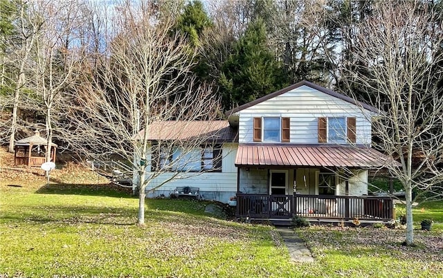 view of front facade with a front yard and a porch