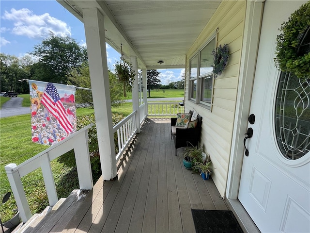 wooden terrace with a porch