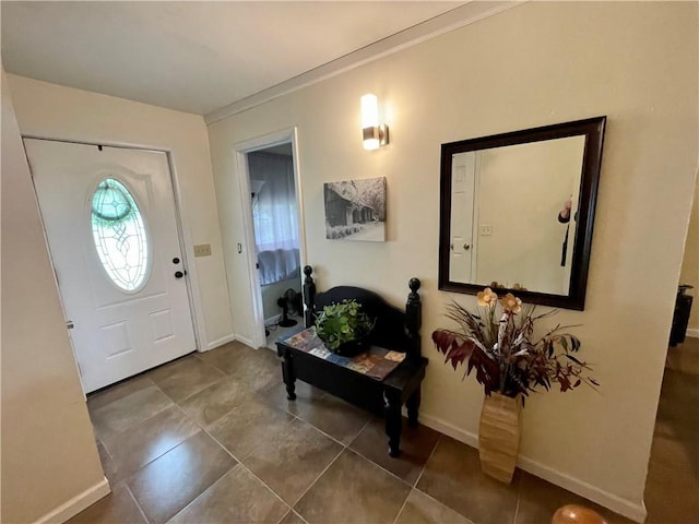 foyer entrance with dark tile patterned flooring