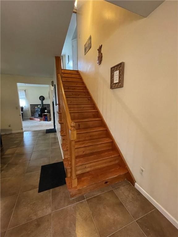 stairs featuring tile patterned floors