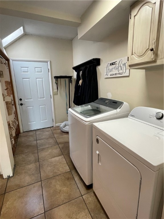 washroom with cabinets, independent washer and dryer, and tile patterned flooring