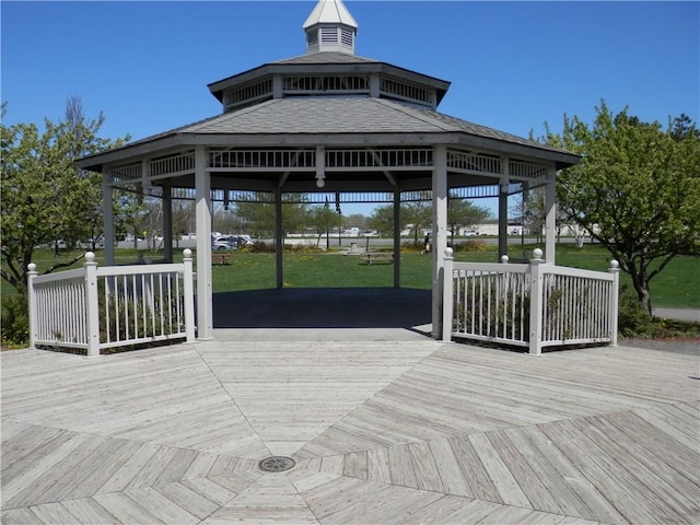 deck with a gazebo and a yard