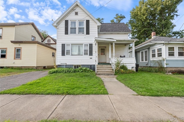 view of front of home featuring a front yard