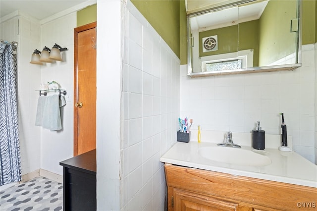 bathroom with tile patterned floors, decorative backsplash, vanity, and tile walls